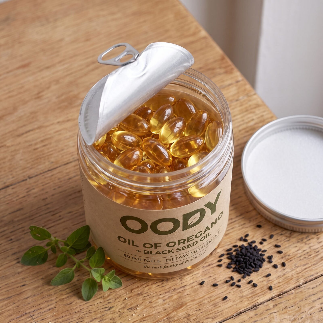 Open OODY jar seen from above, full of golden softgels